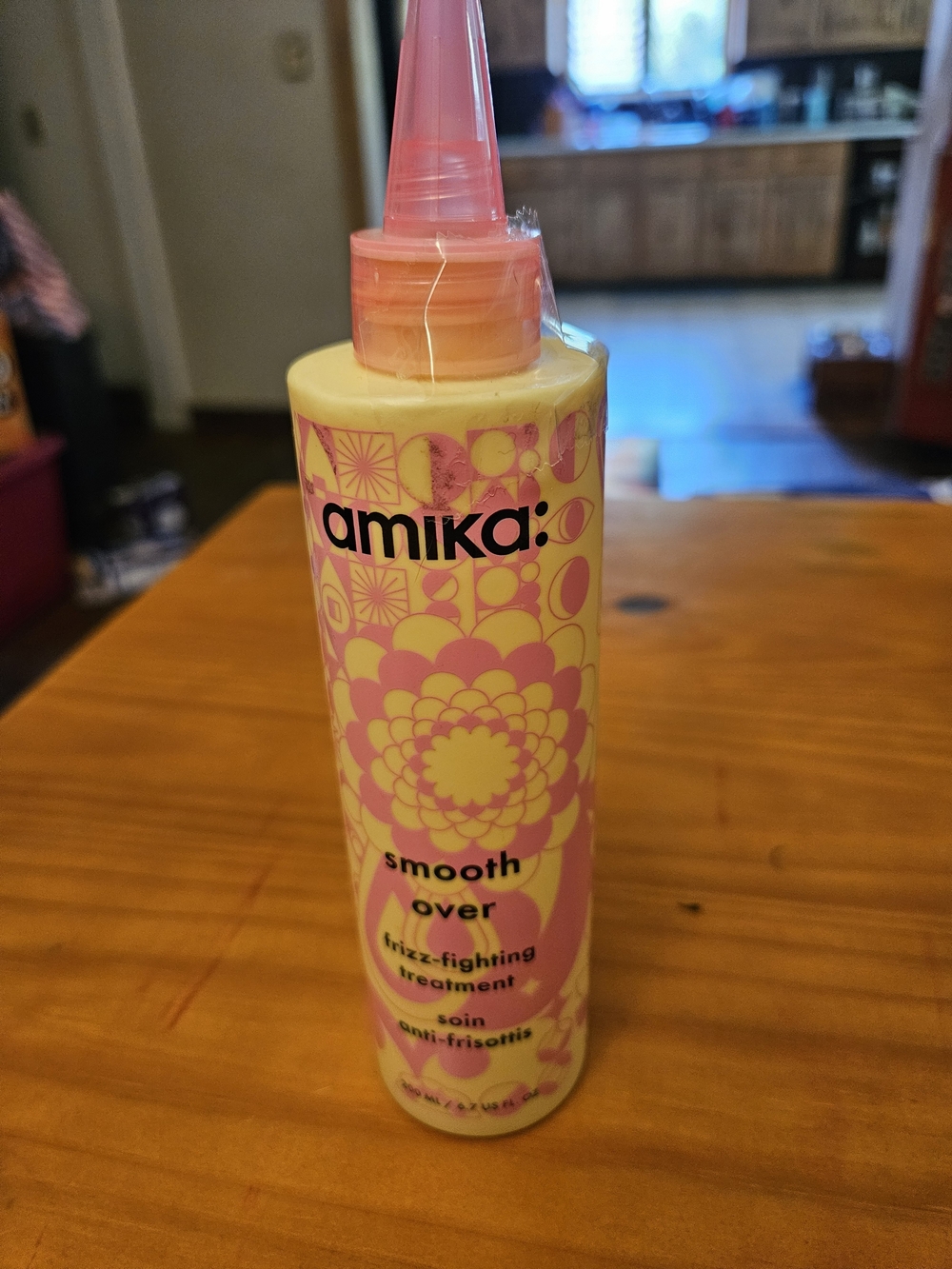 amika Smooth Over Frizz-Fighting Treatment - Yellow & Pink Bottle